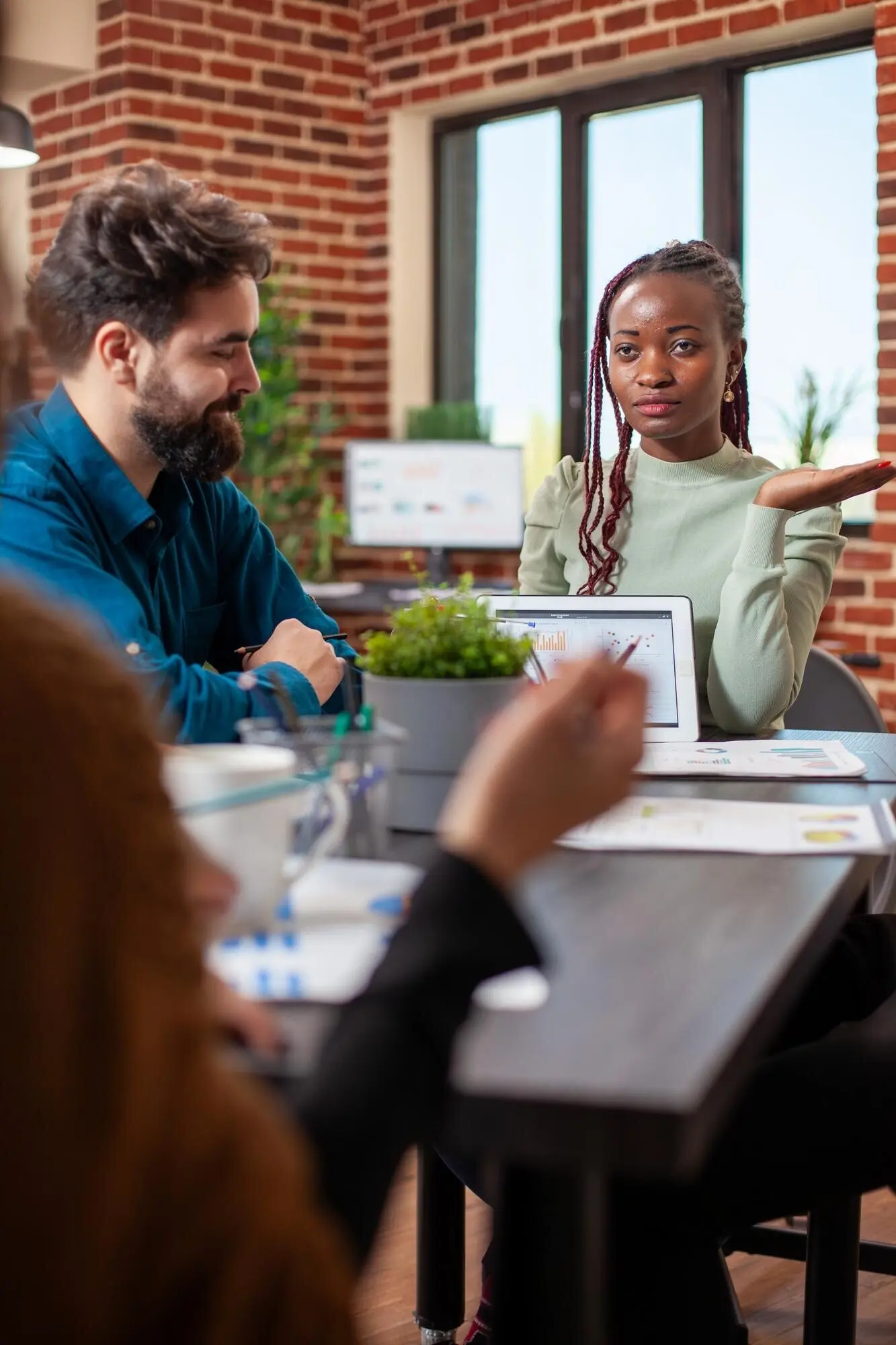 Advisor presenting the company's plans to the team.